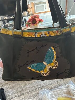 Junior Drake: Women’s Black Shoulder Bag with Teal & Yellow Butterfly Accent by